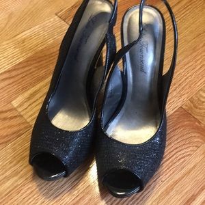 Black sling back shoes.
